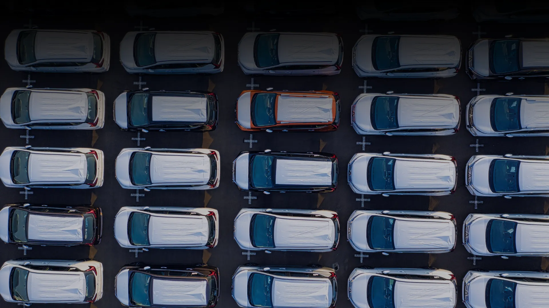 Aerial view of finished vehicles parked in a marshalling yard